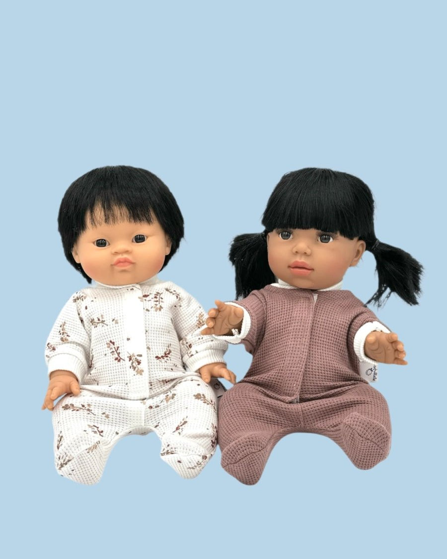 Doll clothes facilitating pretend caregiving scenarios