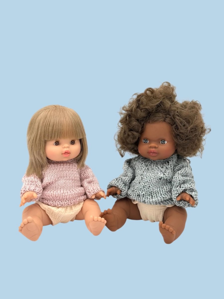 Twin dolls coordinating wardrobe with complementary styles