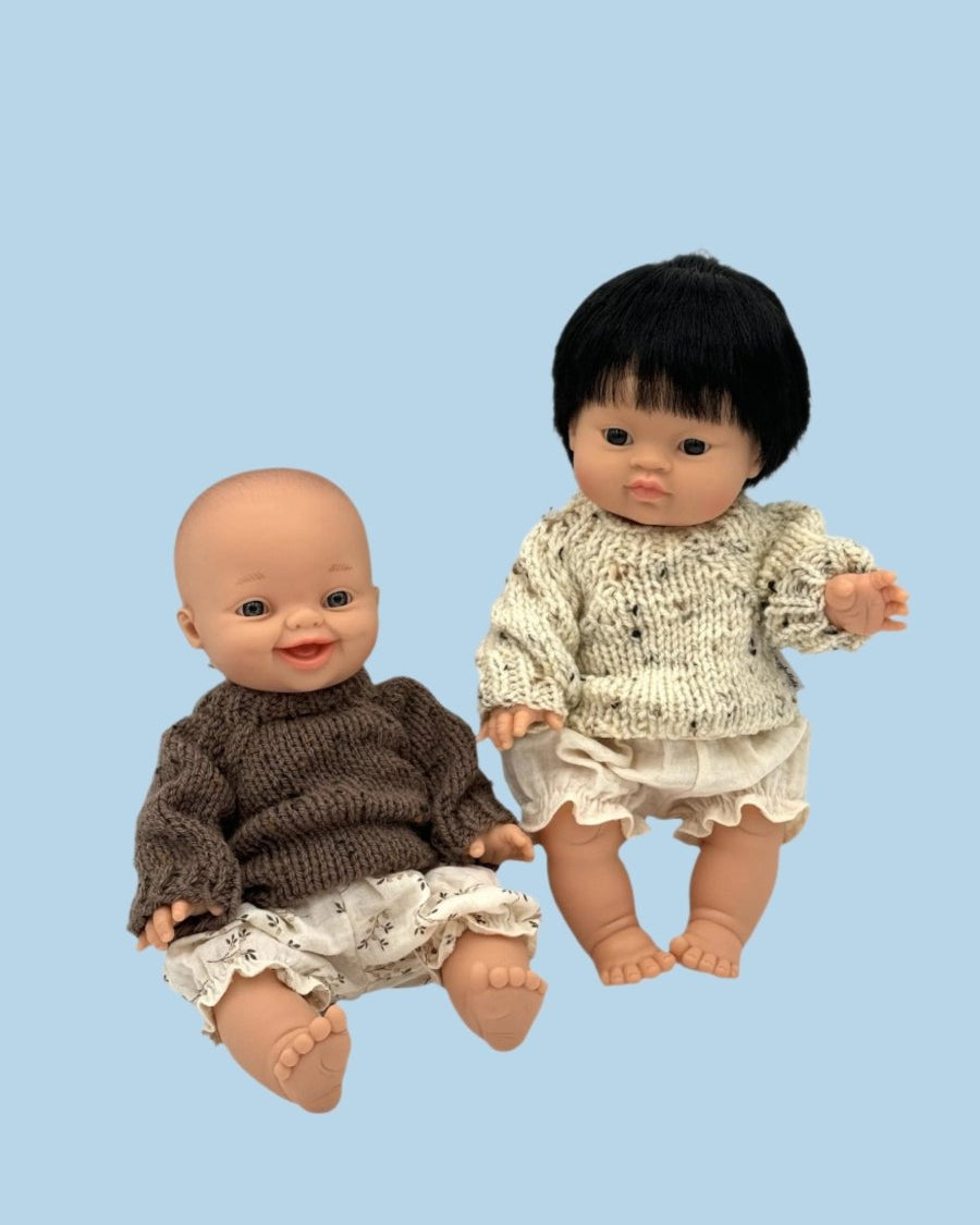 Nautical-themed doll clothing collection with stripes