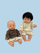 Nautical-themed doll clothing collection with stripes