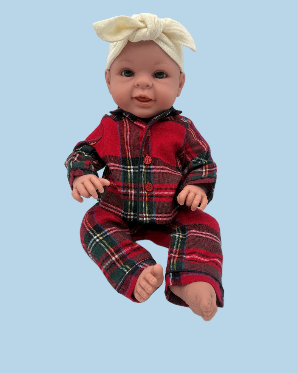 Complete doll sleepwear set in classic red, navy, and green tartan pattern with notched collar