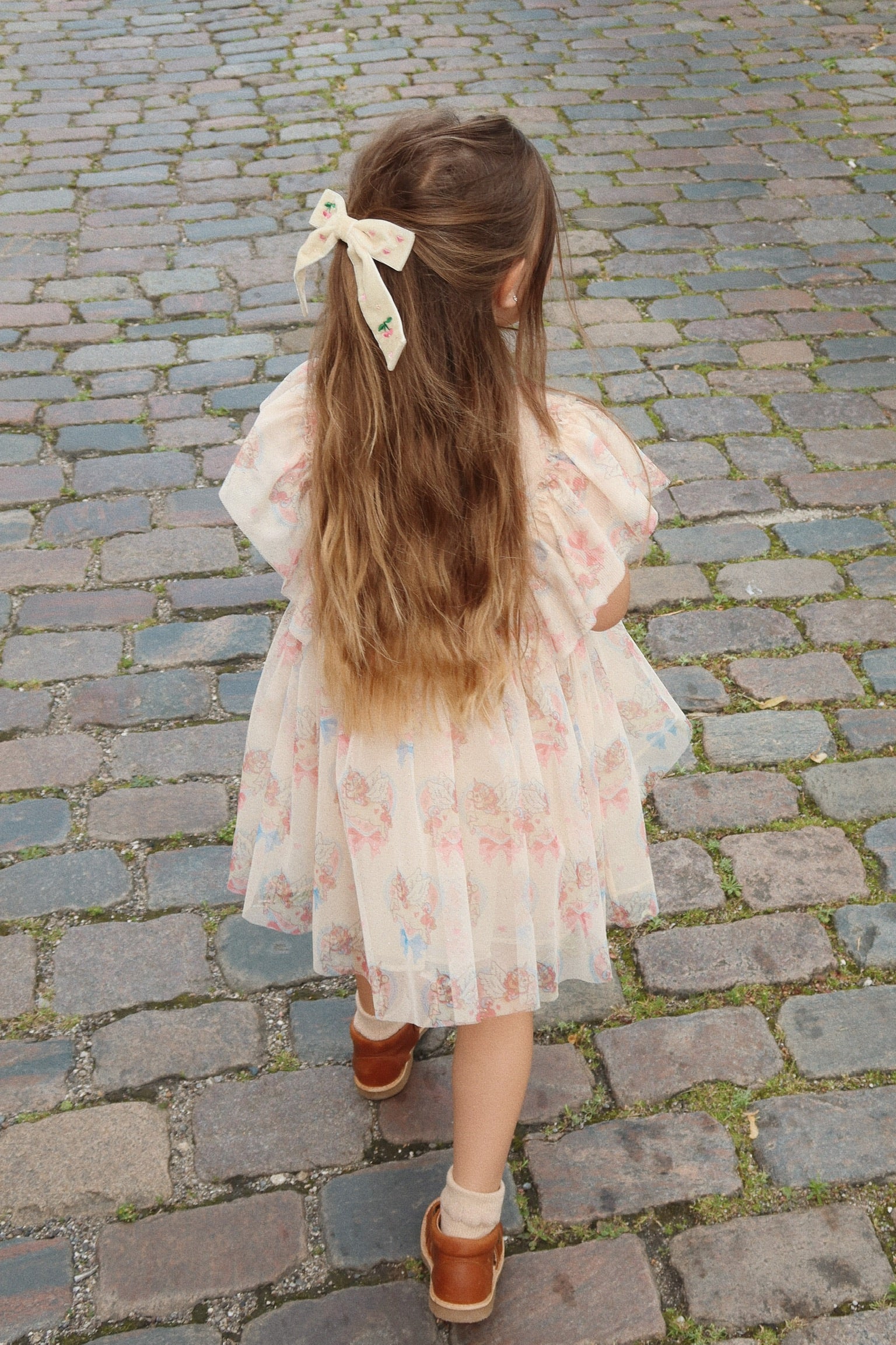 Konges Sloejd Ada Fairy Dress Strolling on Sidewalk