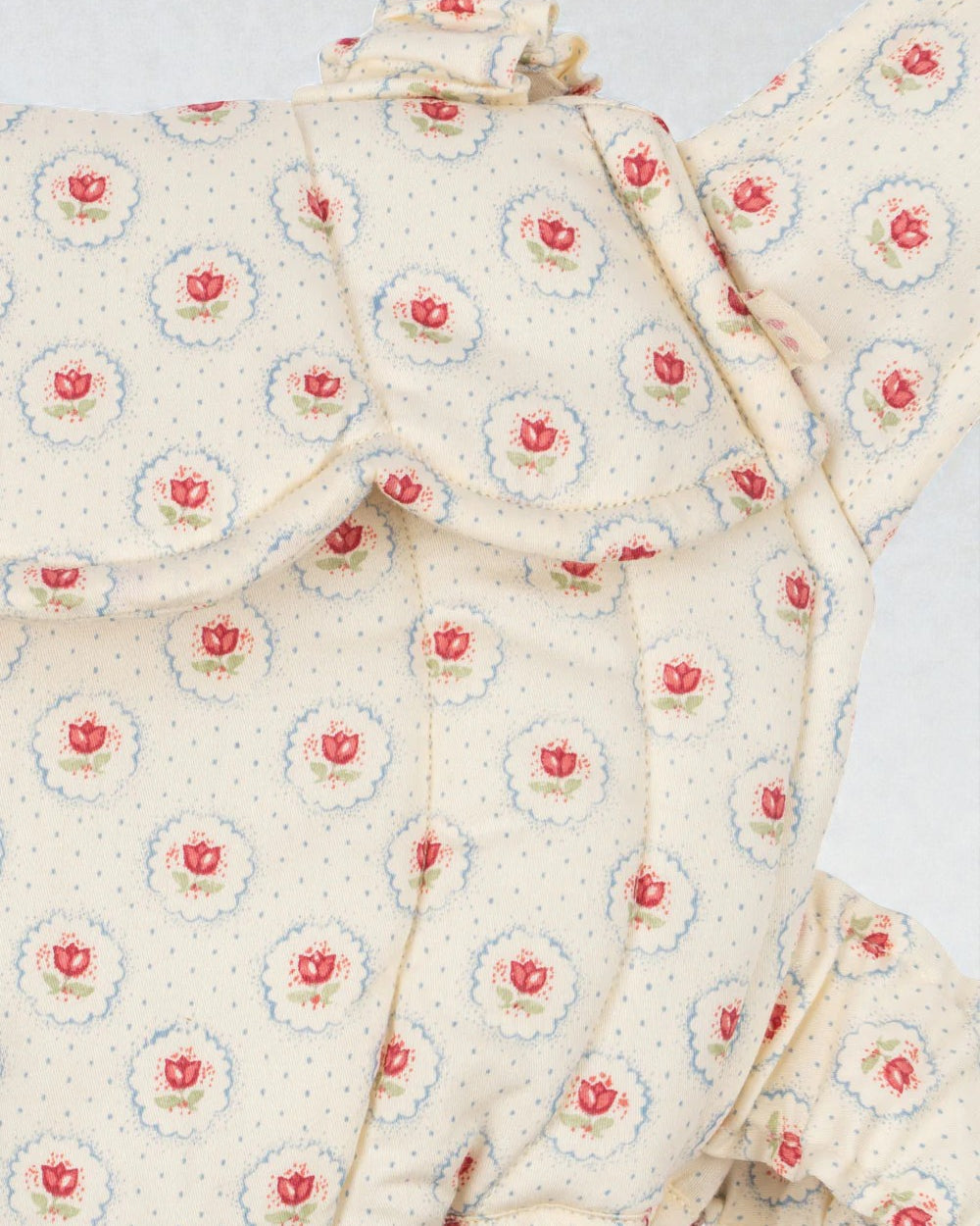 OEKO-TEX cotton carrier showing reverse backpack style for hands-free doll play