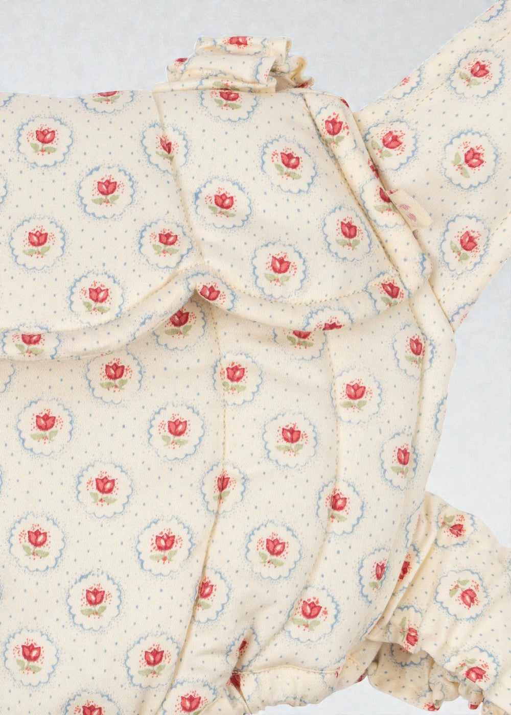 OEKO-TEX cotton carrier showing reverse backpack style for hands-free doll play