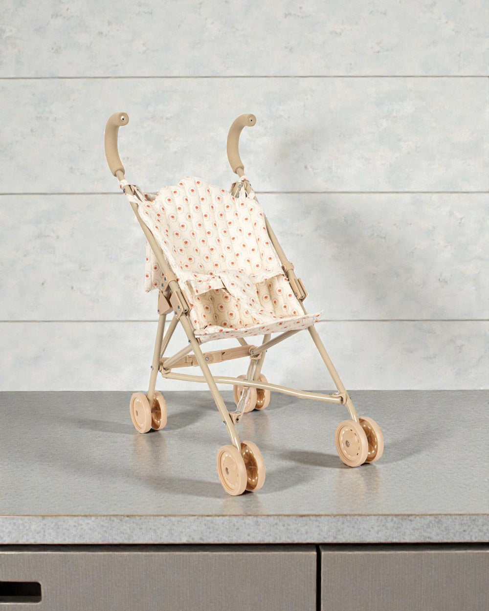 Konges Sløjd Mirage doll stroller with red tulip print and blue scalloped canopy