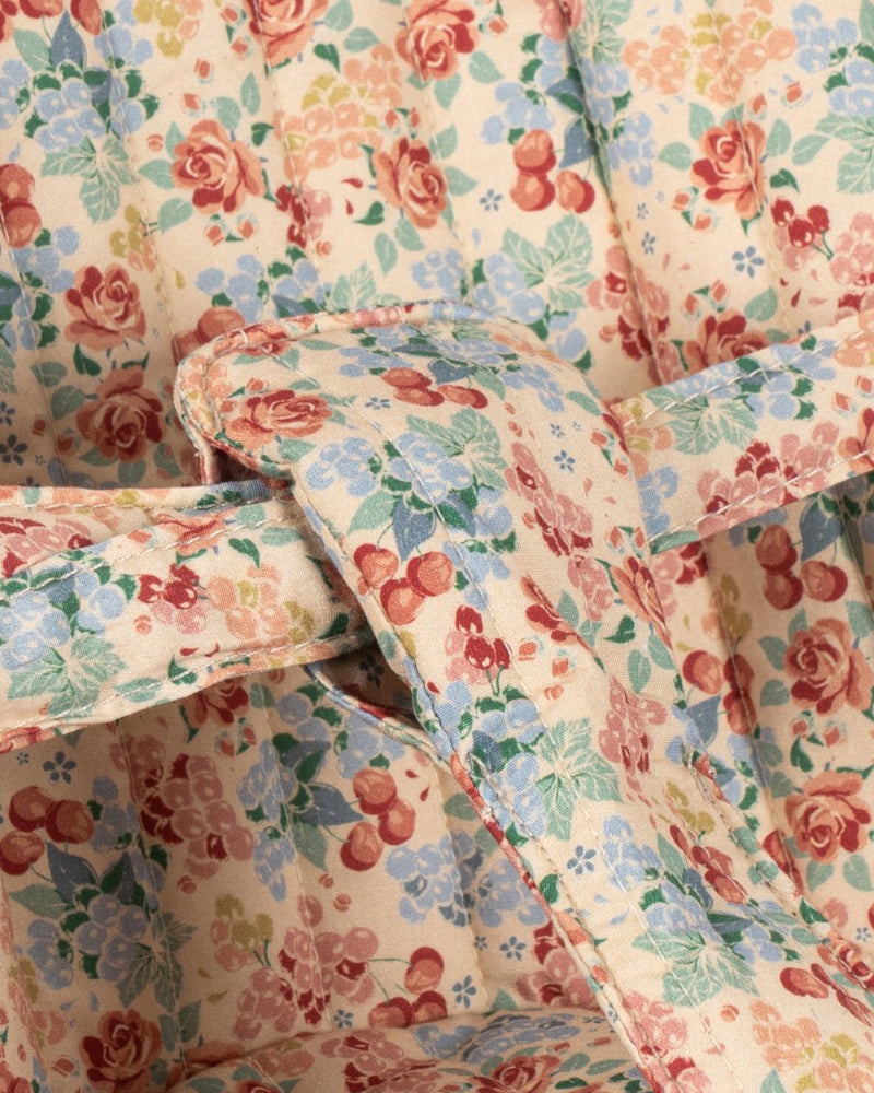 Botanical floral pattern doll buggy with velcro fabric attachment and sturdy push frame