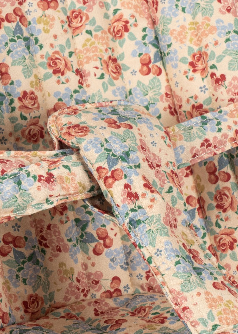 Botanical floral pattern doll buggy with velcro fabric attachment and sturdy push frame