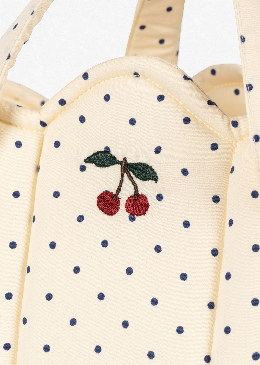 OEKO-TEX cotton bassinet showing cream fabric with blue polka dot pattern