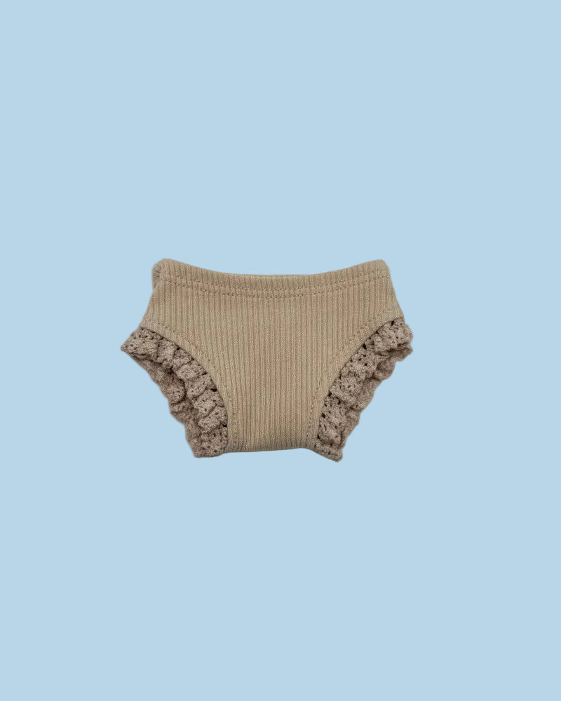 Beige ribbed baby bloomers with ruffled edges