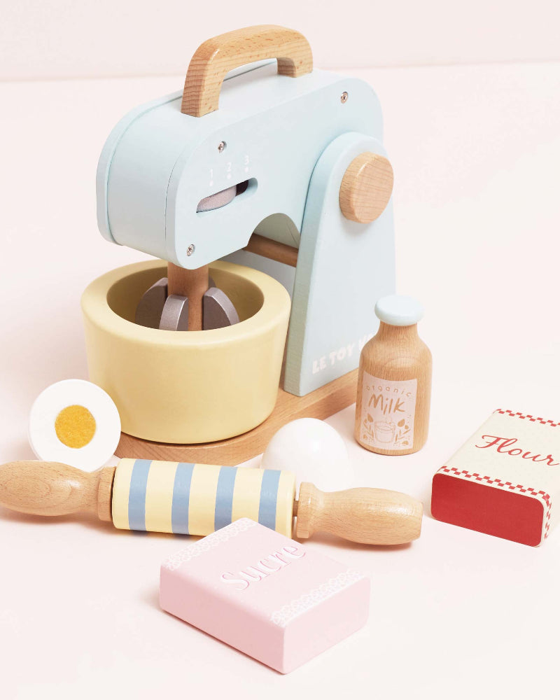 Retro-style toy mixer with moving whisk flour sugar and eggs