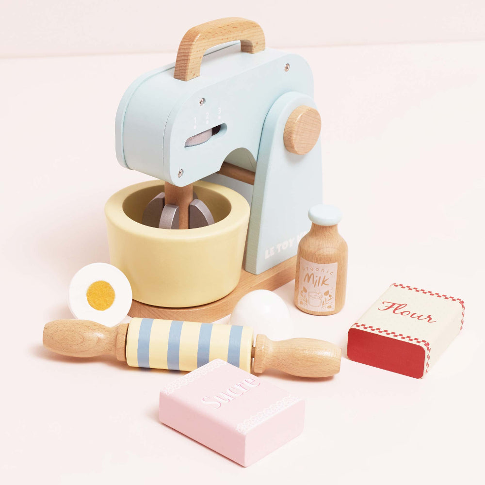 Retro-style toy mixer with moving whisk flour sugar and eggs