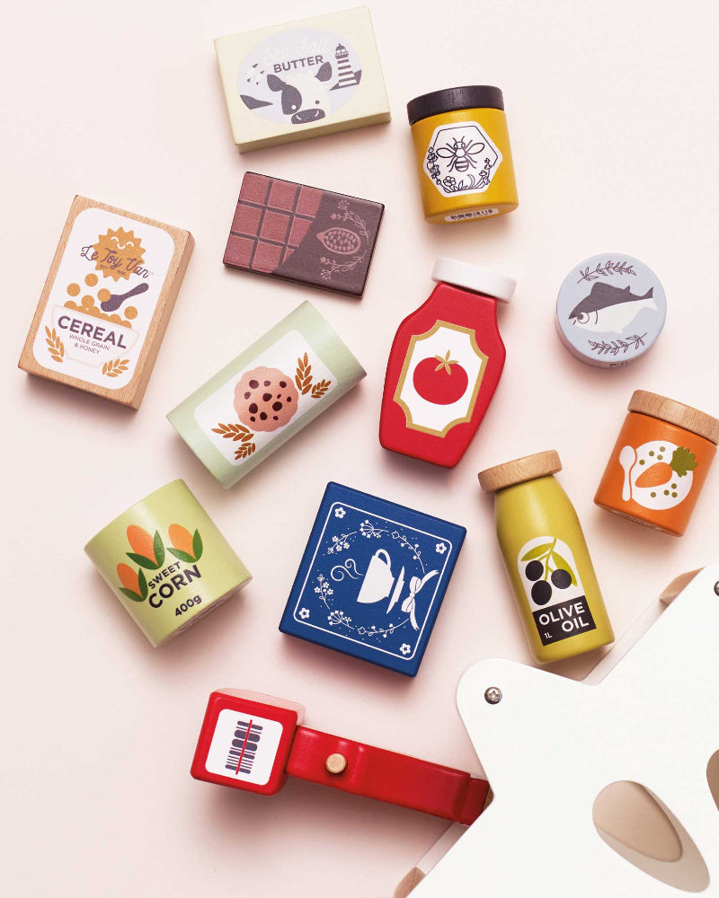 Complete wooden market play set showing colorful illustrated food items and basket