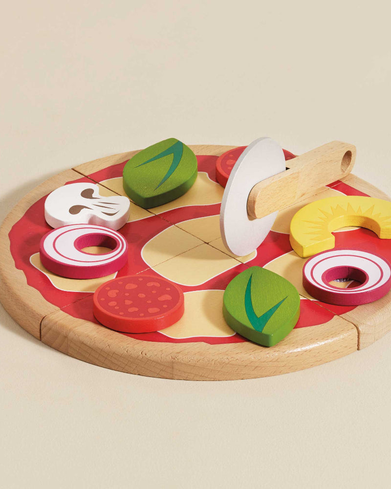 FSC certified wooden pizza toy showing individual slices and serving cutter