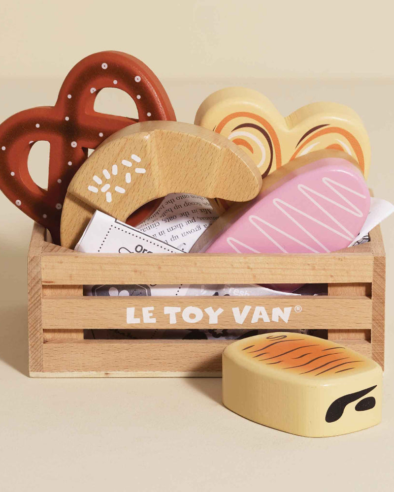 Le Toy Van wooden baker's crate with pretzel croissant iced bun and pastries