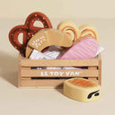 Le Toy Van wooden baker's crate with pretzel croissant iced bun and pastries
