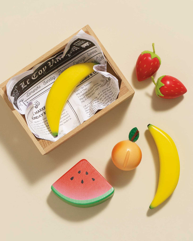 British made wooden fruit toys in storage crate for market pretend play
