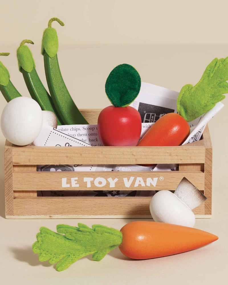 British made wooden vegetable toys in storage crate for market pretend play
