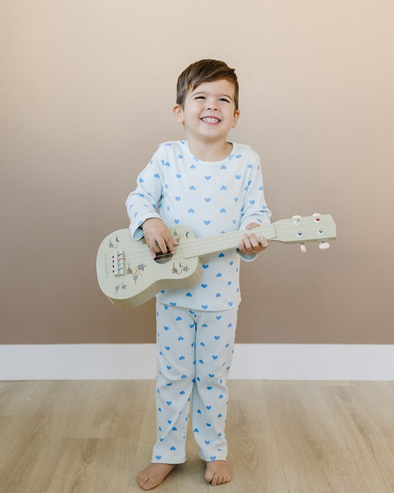 Child wearing Valentine Rose Hearts ribbed cotton play set during active indoor play