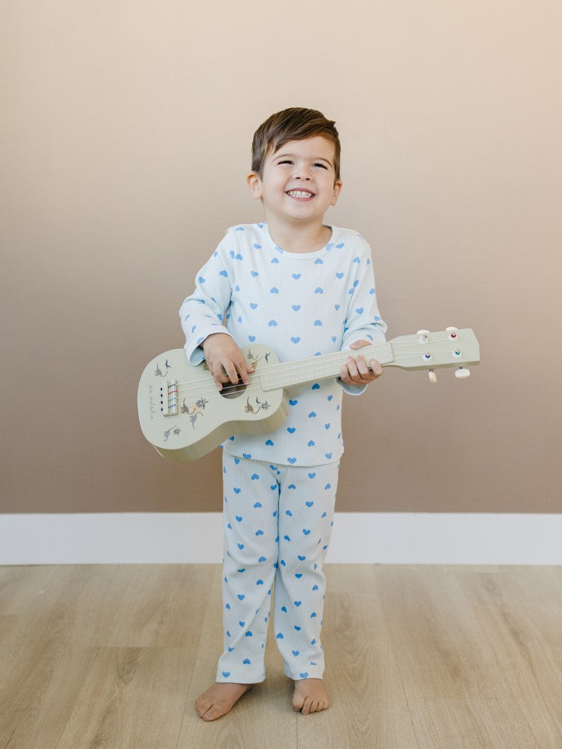 Child wearing Valentine Rose Hearts ribbed cotton play set during active indoor play