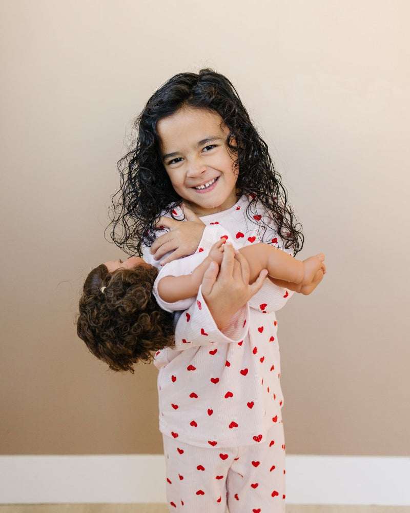 Child wearing Valentine Rose Hearts ribbed cotton play set during active indoor play