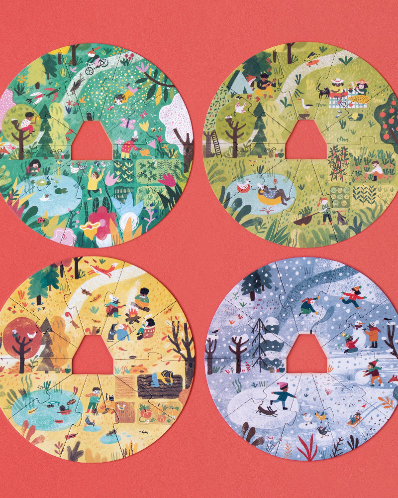Four circular puzzles with different seasonal scenes on a pink background
