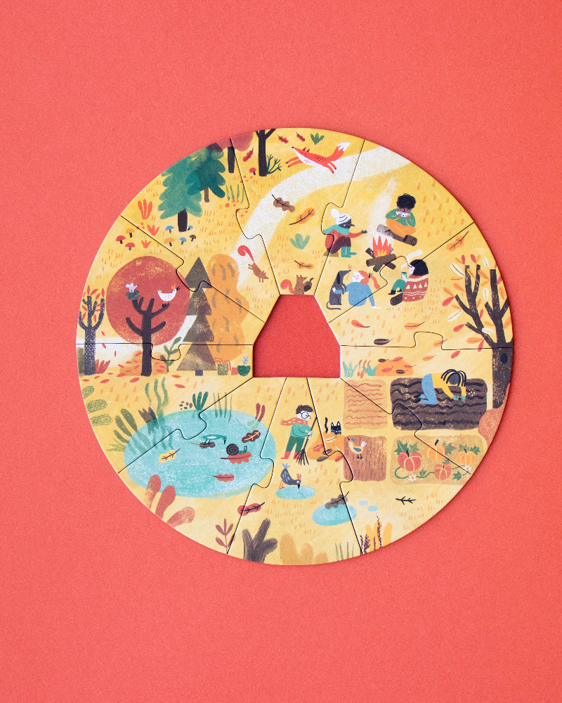 Circular paper cutout with illustrations of children playing on a red background