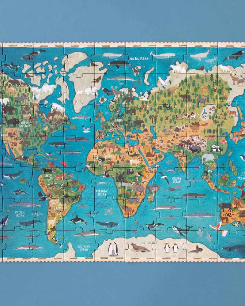 World map puzzle on a blue background