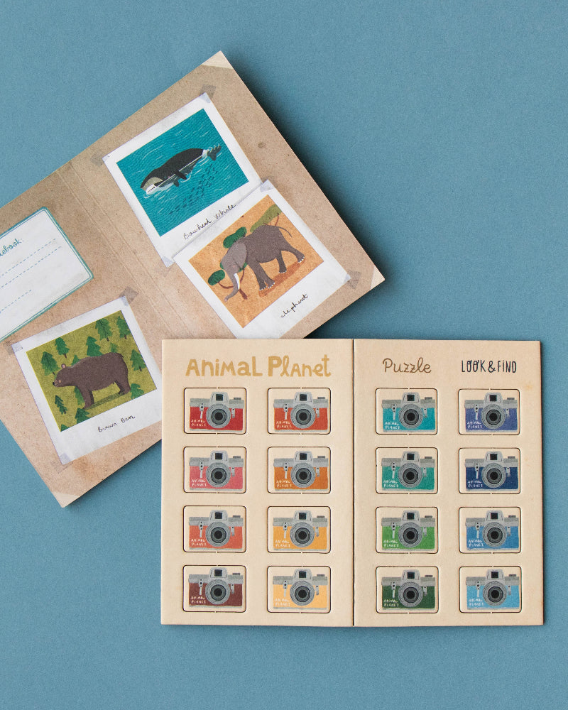 Educational puzzle book with animal illustrations on a blue background