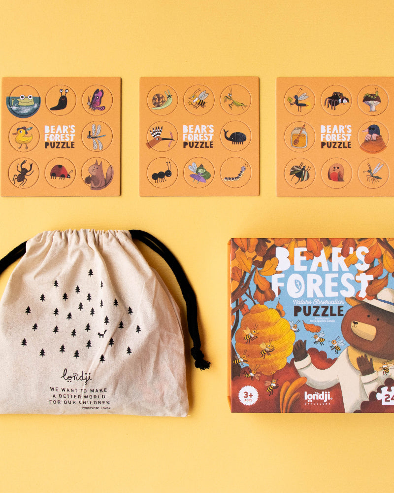 Puzzle boxes with animal illustrations on a yellow background
