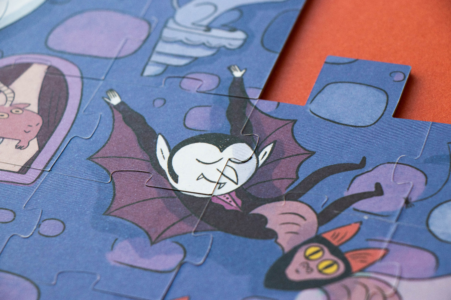 Jigsaw puzzle with cartoon characters on a blue background