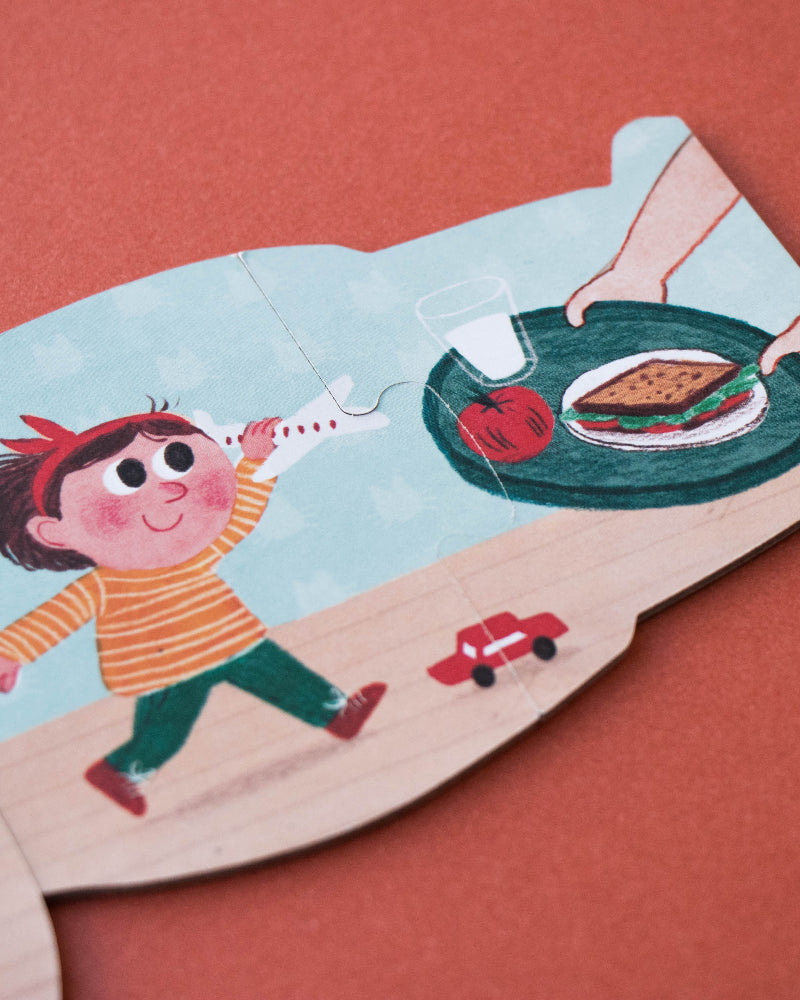 Children's puzzle piece with an illustration of a child and a hamburger on a red background
