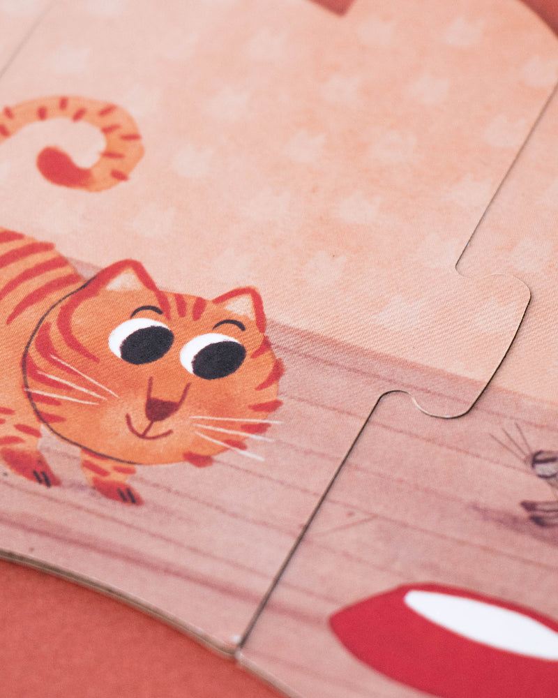 Children's puzzle with cartoon tiger and mouse on a wooden surface