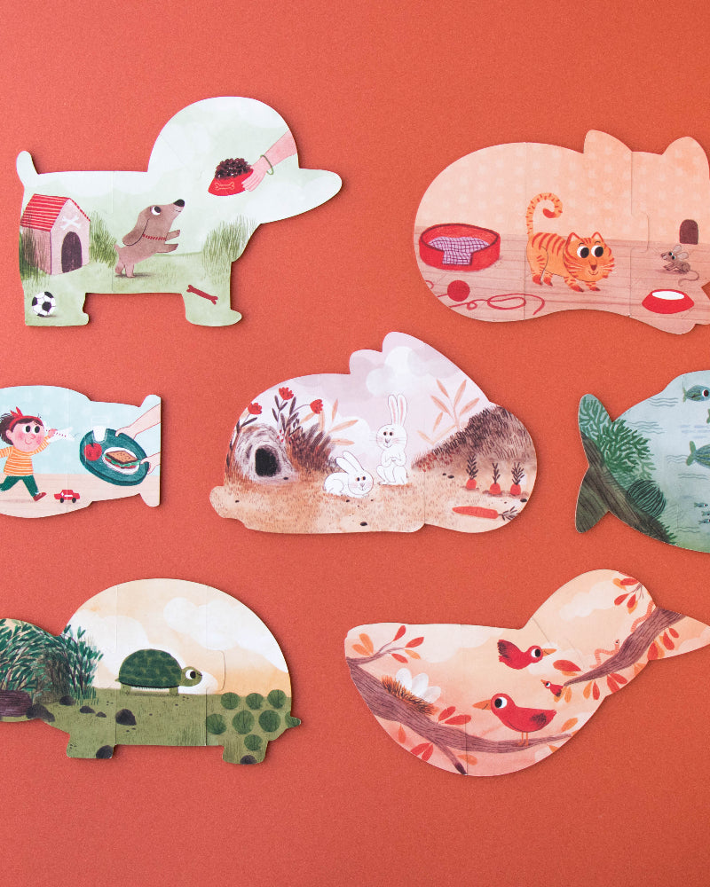 Set of animal-shaped puzzles on a red background