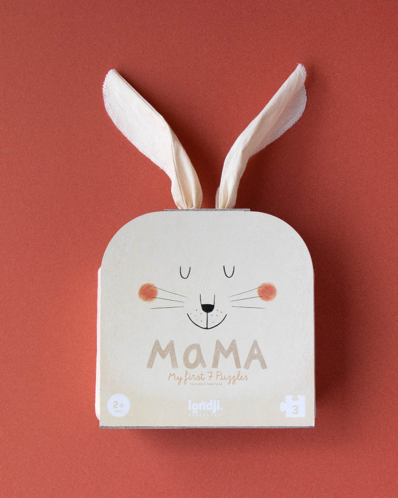 Product packaging with bunny ears and 'Mama' text on a red background