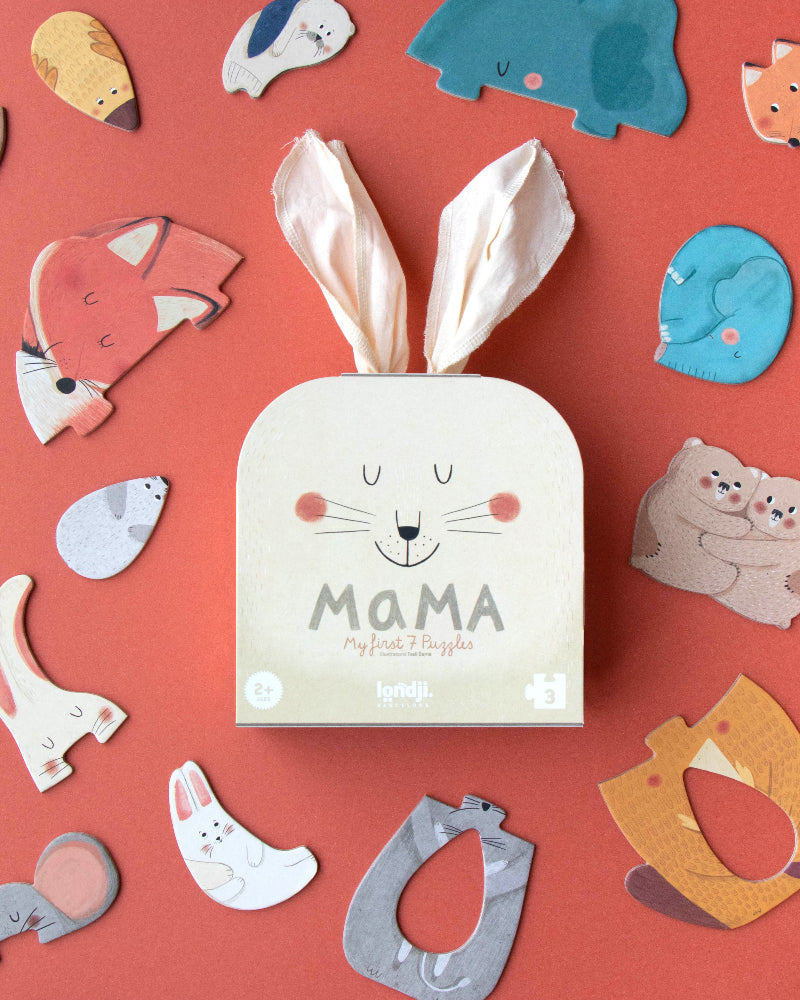 Londji Mama puzzle set showing 7 shaped mama and baby animal puzzles on a coral background