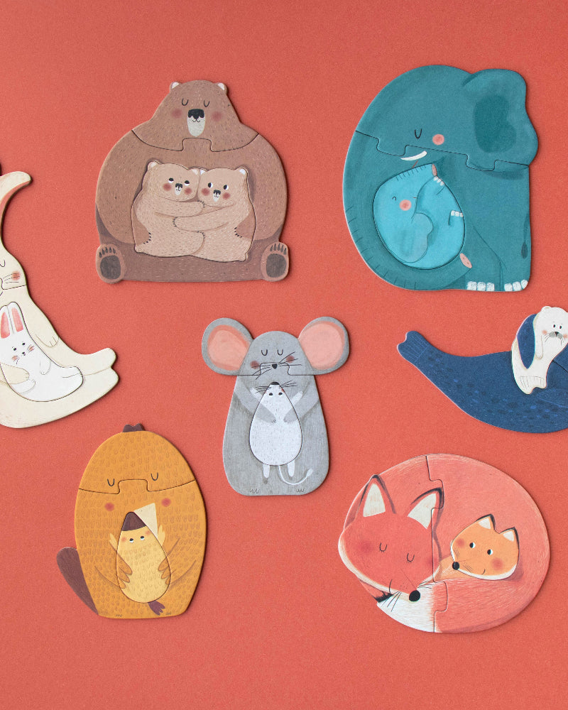 Set of animal-shaped puzzles on a red background