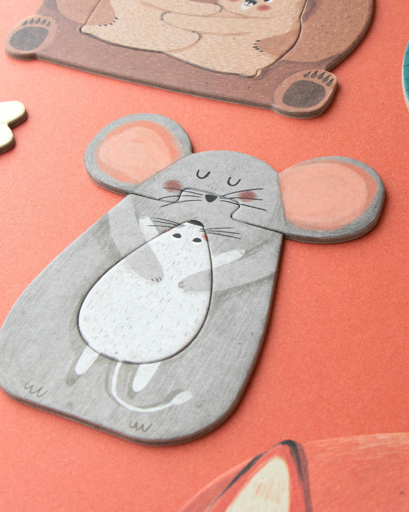 Collection of animal-shaped puzzles on a pink surface