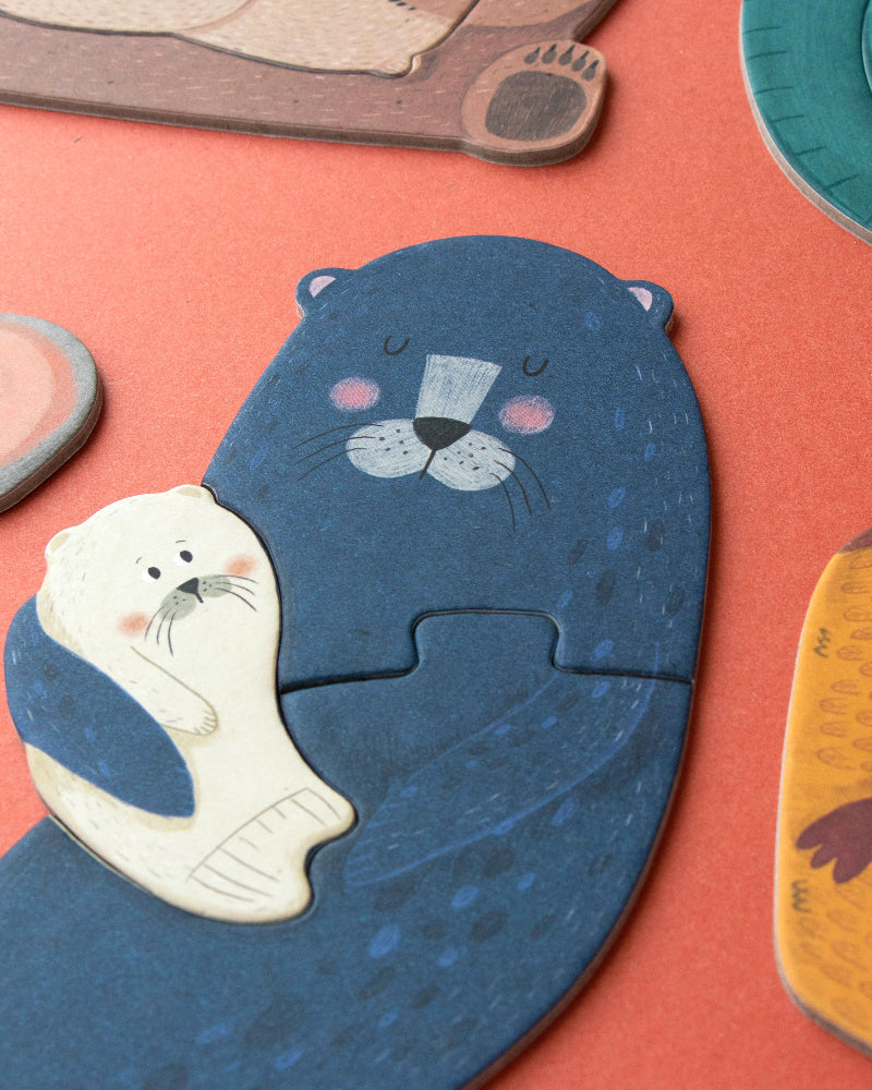 Set of animal-shaped puzzles on a red surface