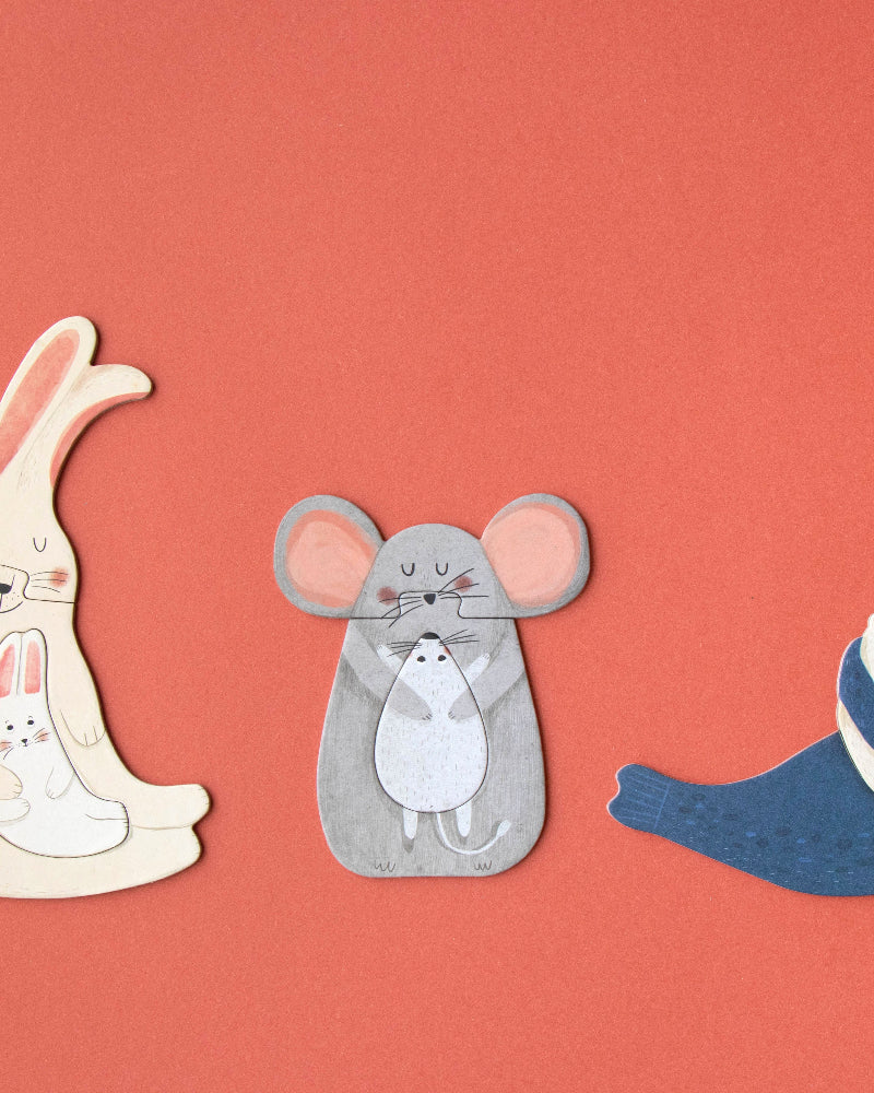 Three cartoon animal puzzles on a red background