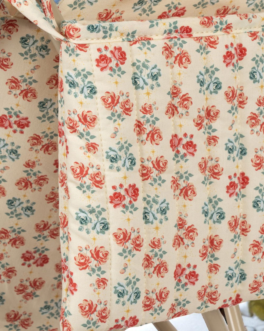 European-design doll stroller showing storage basket and collapsible frame construction