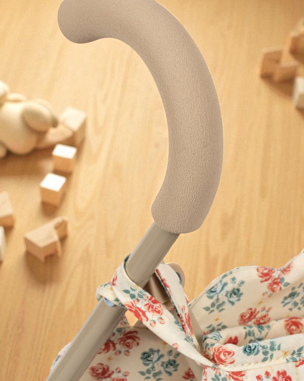 Collapsible doll stroller frame detail showing fold mechanism and iron construction