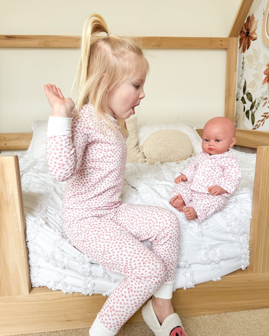 High five in matching pink pajamas