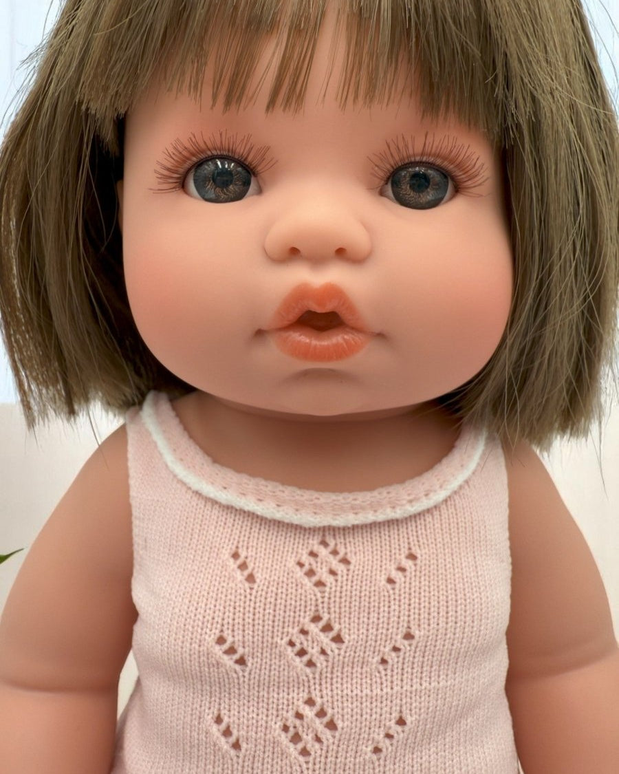 Milan baby doll for toddlers featuring realistic vinyl construction and moveable limbs for developmental play
