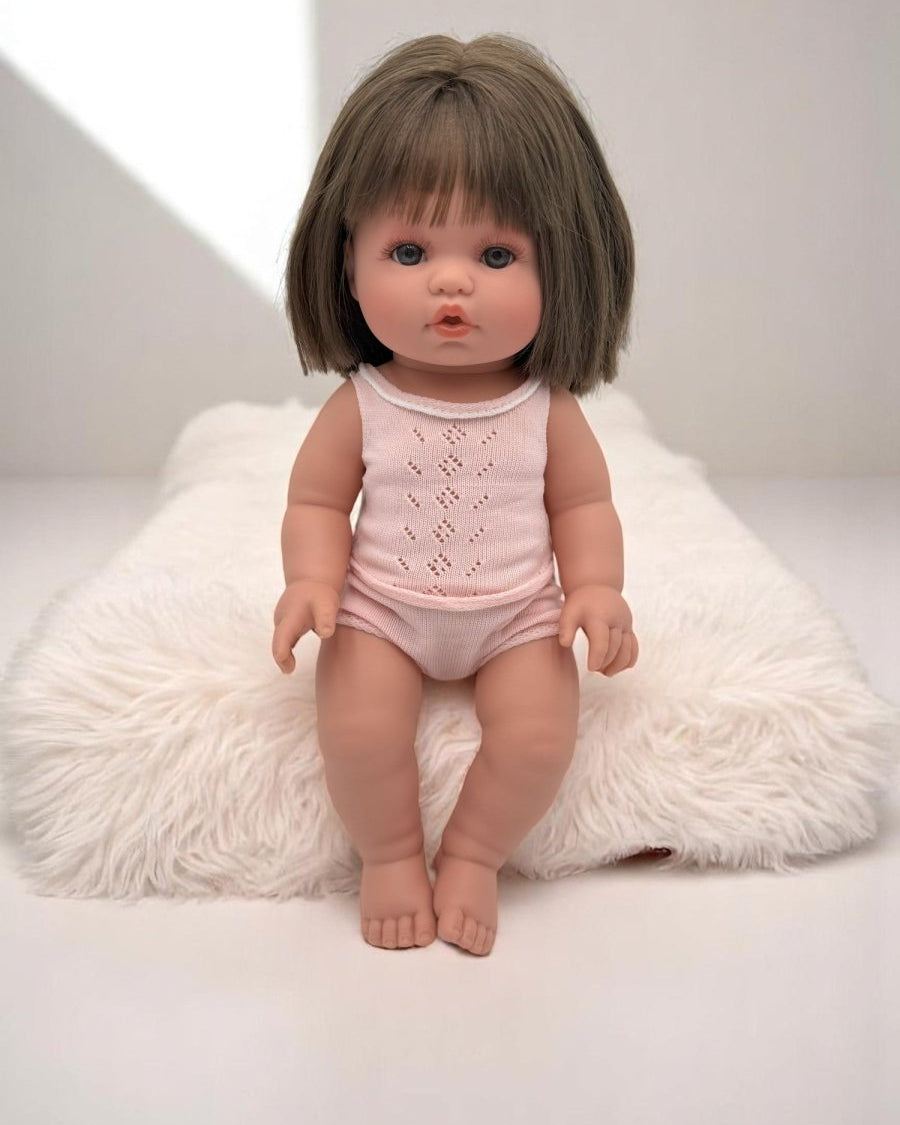 Lifelike baby doll Milan with brunette bob haircut perfect for children's playroom nurturing activities