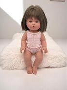 Lifelike baby doll Milan with brunette bob haircut perfect for children's playroom nurturing activities