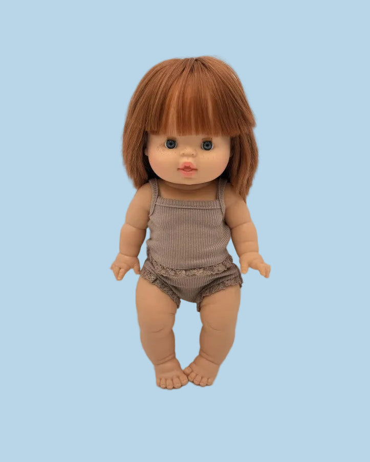 Doll with brown hair and outfit