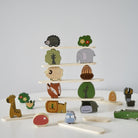 Forest-themed Montessori stacking blocks with various animals, mushrooms, and trees for creative play
