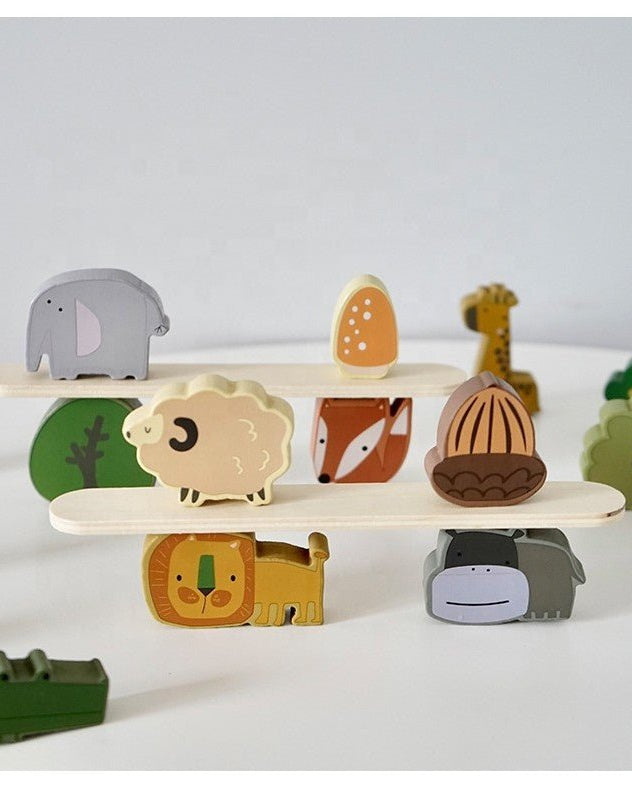 Individual wooden Montessori stacking blocks showing forest animals including fox, sheep, and giraffe