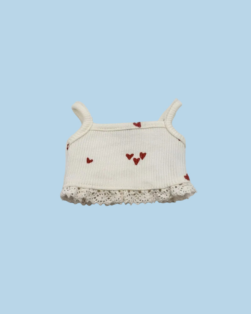 White baby top with red heart designs and lace trim