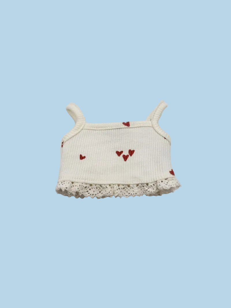 White baby top with red heart designs and lace trim
